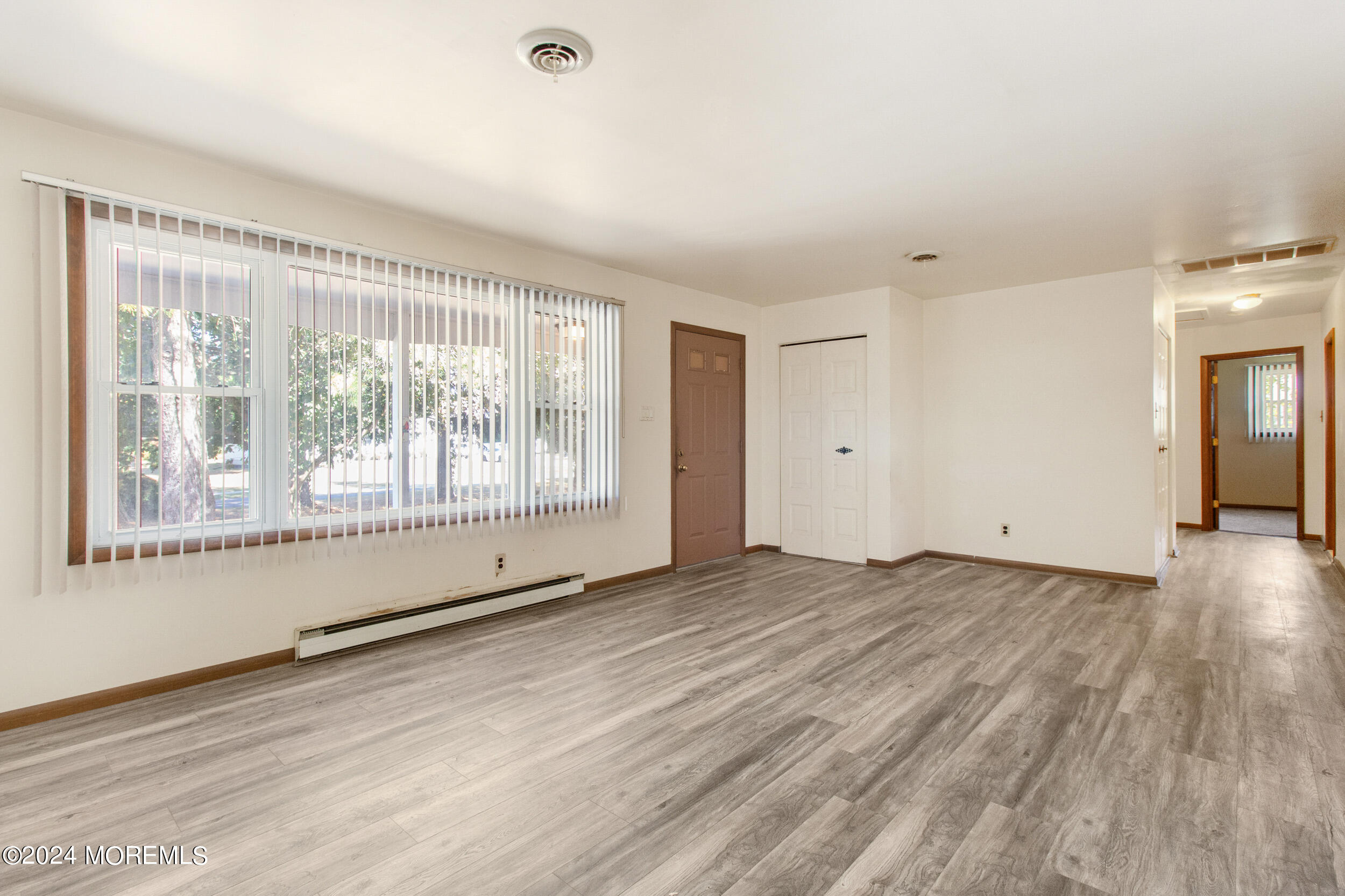 57 Quaker Road Mickleton, NJ 08056 - Photo 5 of 41 a view of an empty room with wooden floor and a window