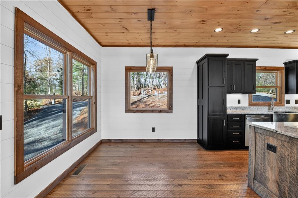 142 Red Oak Trail Ellijay, GA 30540 - Photo 12 of 63 a kitchen with stainless steel appliances granite countertop a refrigerator a oven and a wooden floors