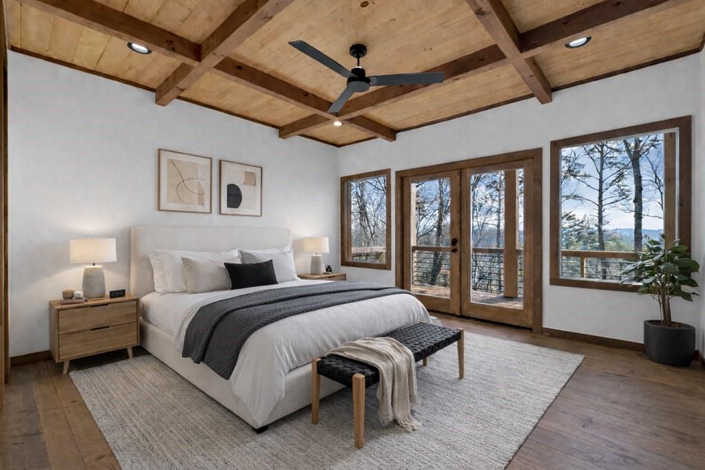 142 Red Oak Trail Ellijay, GA 30540 - Photo 16 of 63 a bedroom with a large bed and a large window