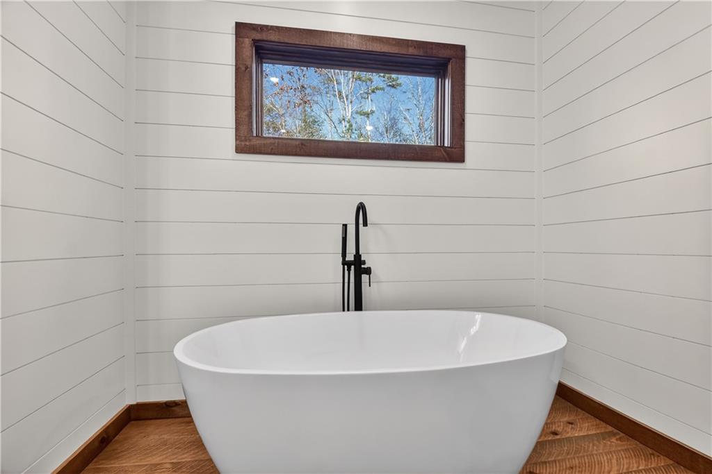 142 Red Oak Trail Ellijay, GA 30540 - Photo 19 of 63 a white bath tub sitting in a bathroom