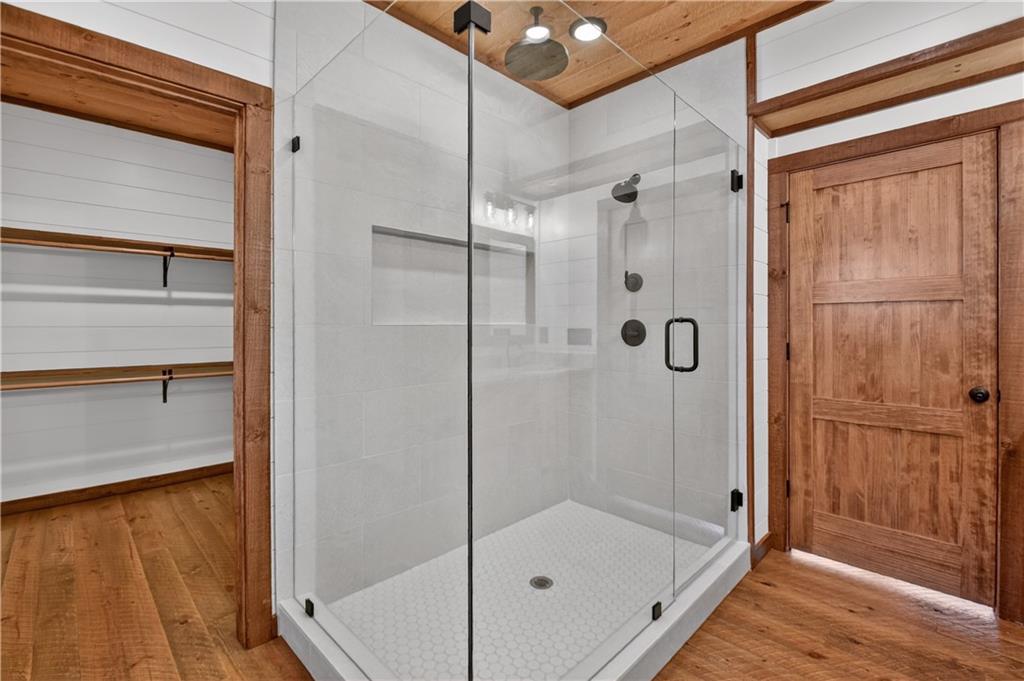 142 Red Oak Trail Ellijay, GA 30540 - Photo 20 of 63 a bathroom with a glass shower door