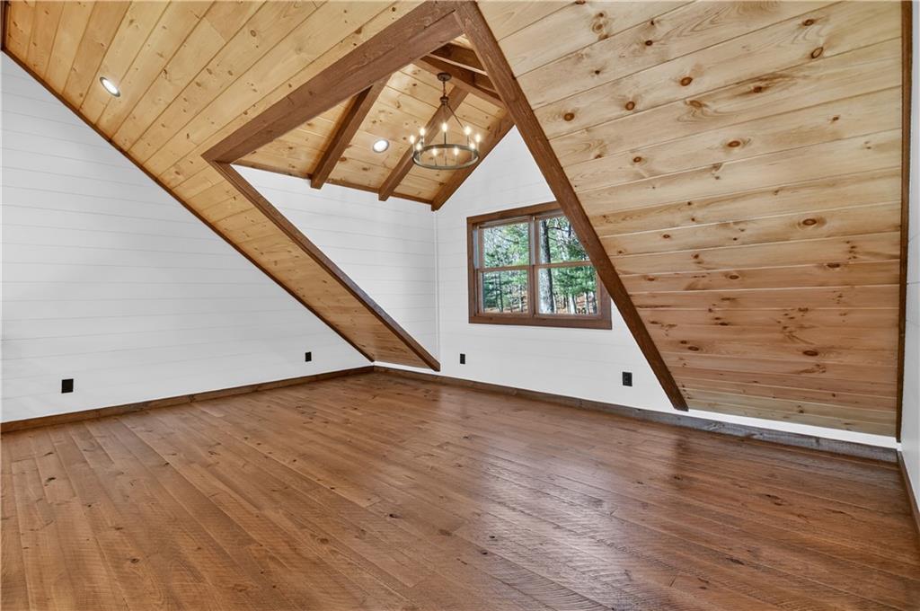 142 Red Oak Trail Ellijay, GA 30540 - Photo 26 of 63 a view of a hallway with wooden floor and staircase