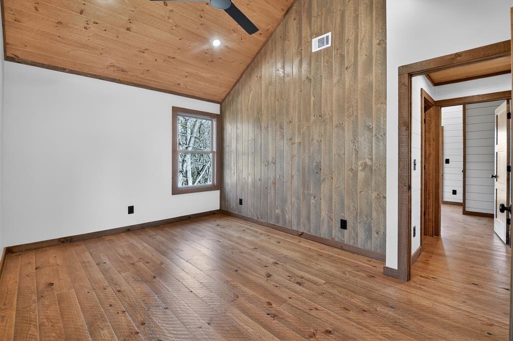 142 Red Oak Trail Ellijay, GA 30540 - Photo 29 of 63 a view of an empty room with wooden floor and a window
