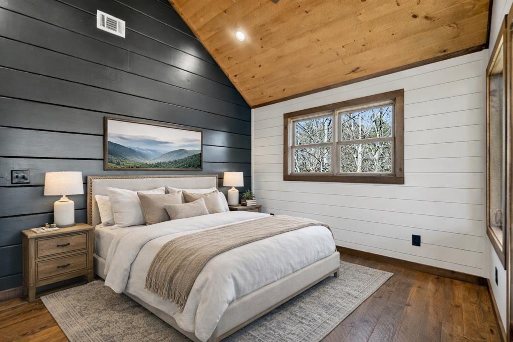 142 Red Oak Trail Ellijay, GA 30540 - Photo 31 of 63 a bedroom with a large bed and a window