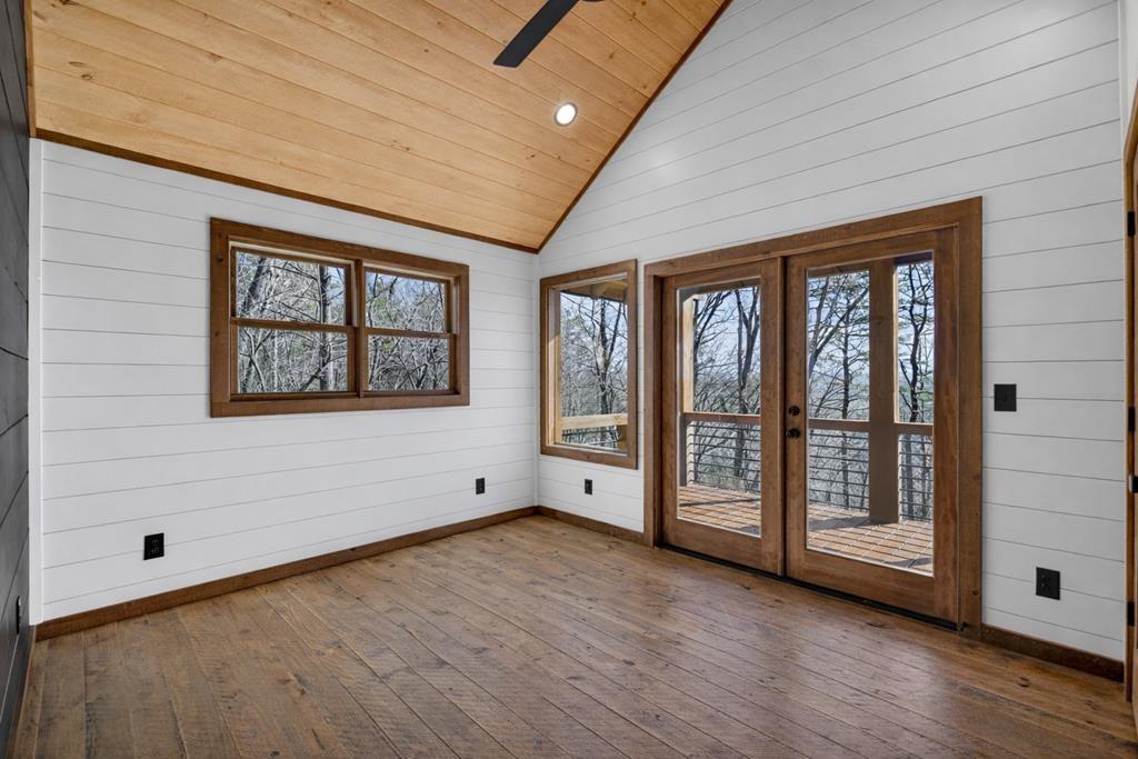 142 Red Oak Trail Ellijay, GA 30540 - Photo 33 of 63 a view of an empty room with window and wooden floor