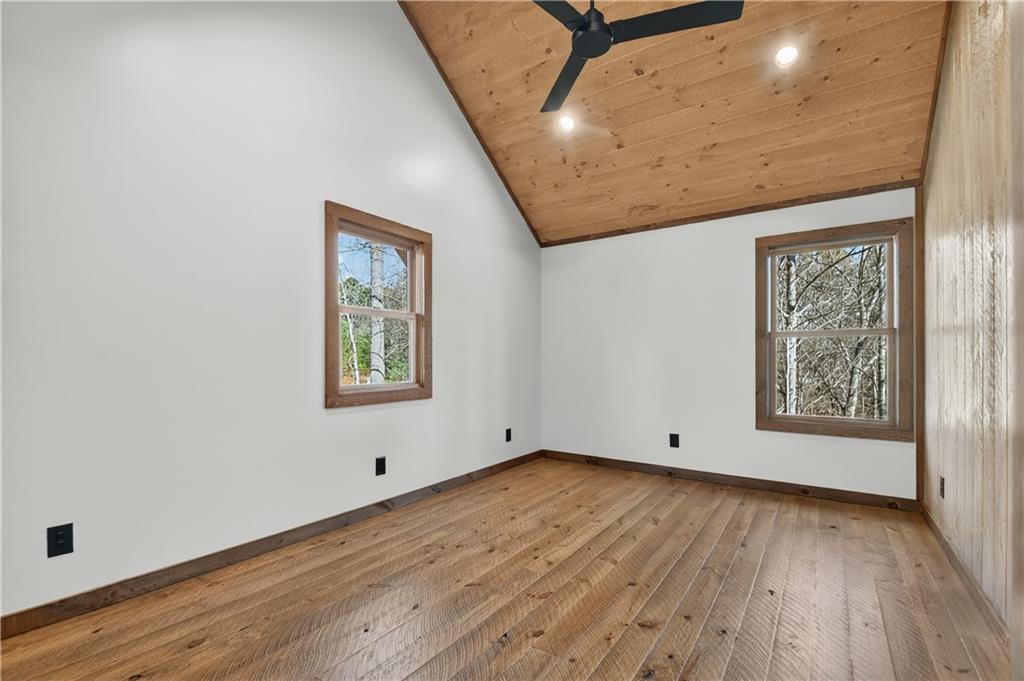 142 Red Oak Trail Ellijay, GA 30540 - Photo 34 of 63 an empty room with wooden floor and windows