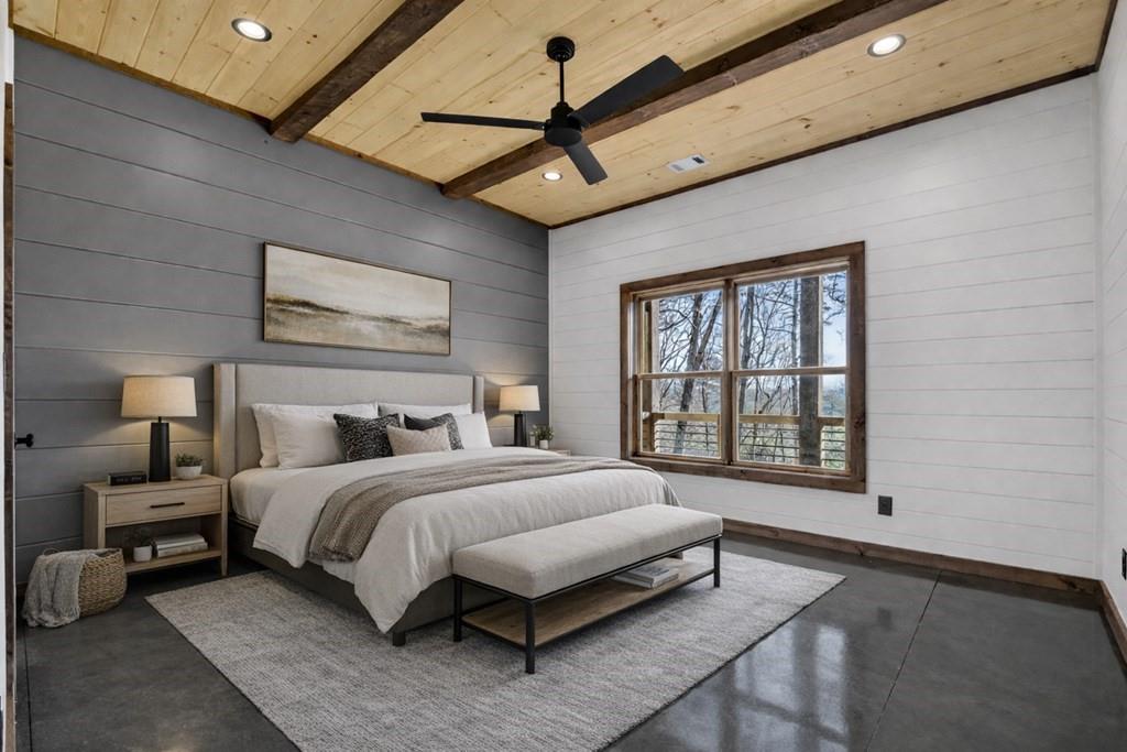 142 Red Oak Trail Ellijay, GA 30540 - Photo 44 of 63 a bedroom with a large bed chandelier and a large window