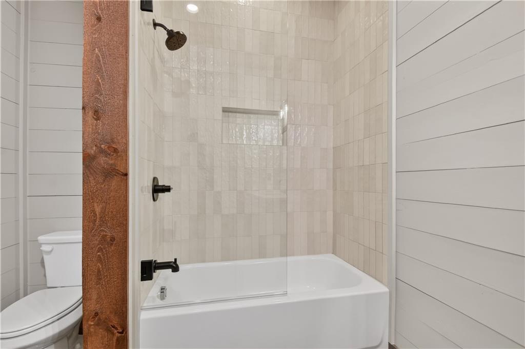 142 Red Oak Trail Ellijay, GA 30540 - Photo 47 of 63 a bathroom with a bathtub and shower