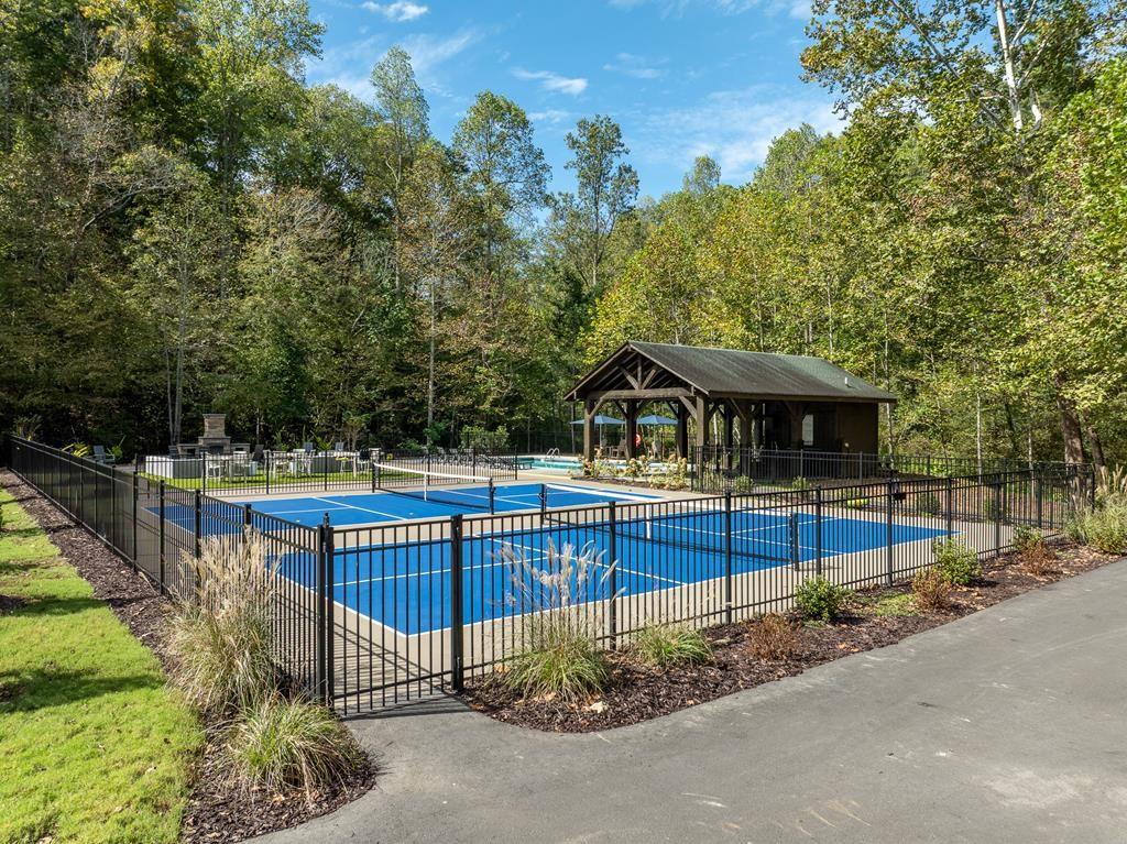 142 Red Oak Trail Ellijay, GA 30540 - Photo 56 of 63 a front view of a house with wooden fence