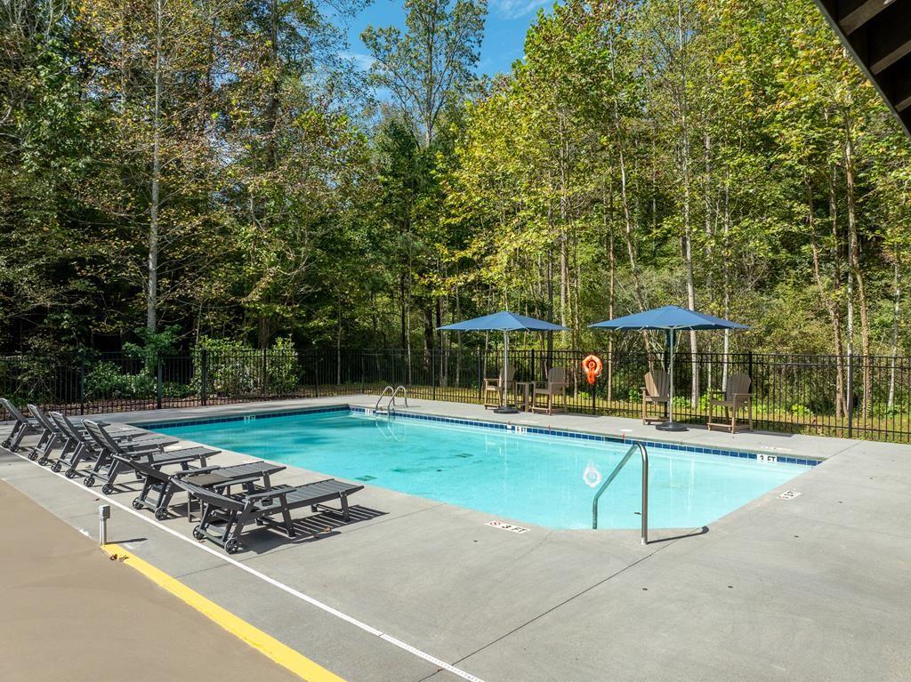 142 Red Oak Trail Ellijay, GA 30540 - Photo 58 of 63 a view of a swimming pool and a yard