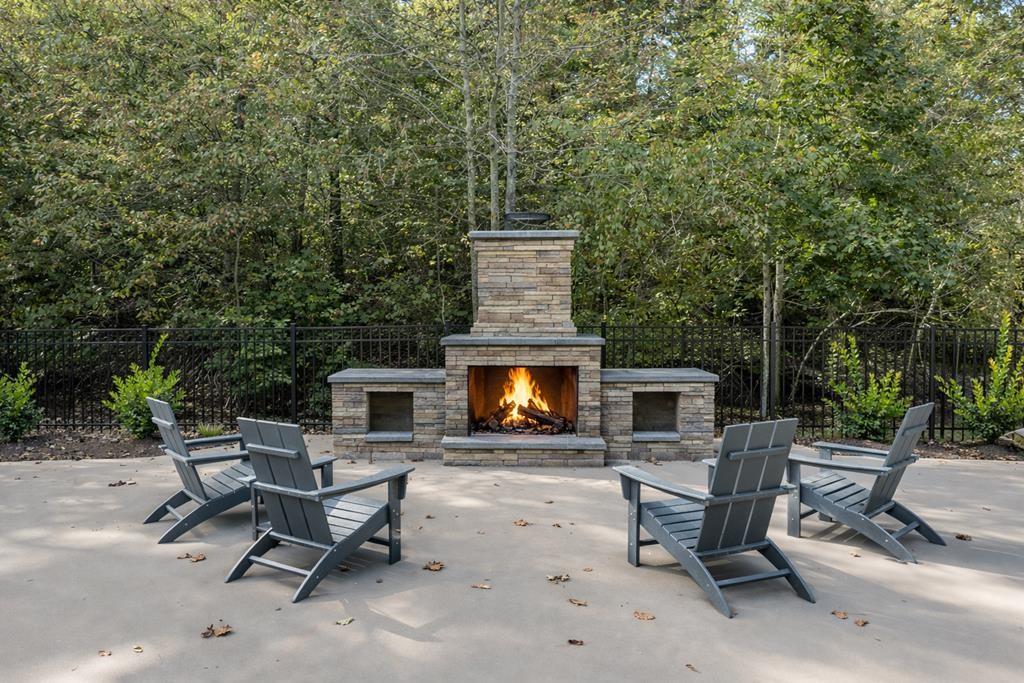 142 Red Oak Trail Ellijay, GA 30540 - Photo 59 of 63 a backyard of a house with fire pit and outdoor space