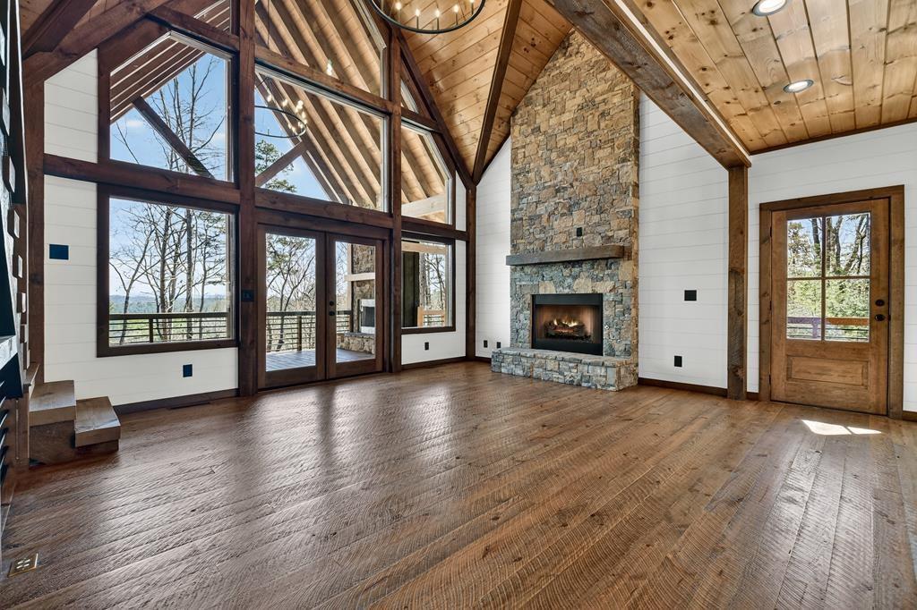 142 Red Oak Trail Ellijay, GA 30540 - Photo 7 of 63 a view of an empty room with wooden floor and a window