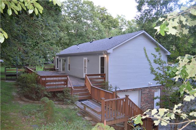 208 Turtle Neck Road Fairview, TN 37062 - Photo 19 of 20 a front view of a house with a yard and outdoor seating