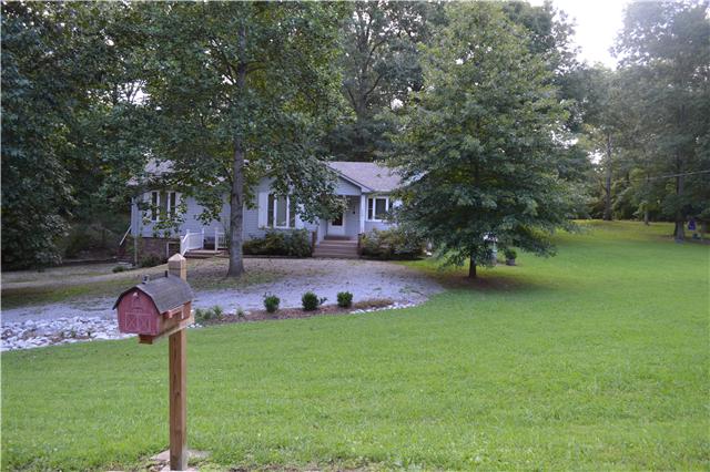 208 Turtle Neck Road Fairview, TN 37062 - Photo 2 of 20 a front view of a house with garden