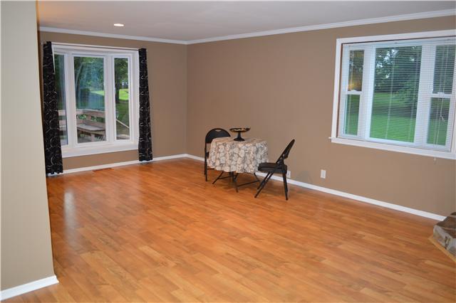 208 Turtle Neck Road Fairview, TN 37062 - Photo 3 of 20 a chairs sitting in a room next to a window