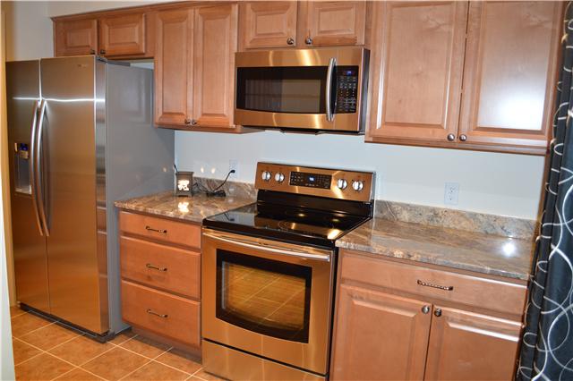 208 Turtle Neck Road Fairview, TN 37062 - Photo 8 of 20 a kitchen with appliances cabinets and a counter top space