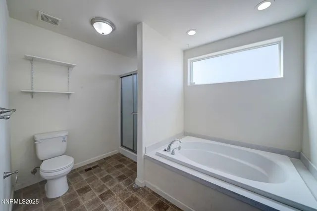 a room with a bed and a window