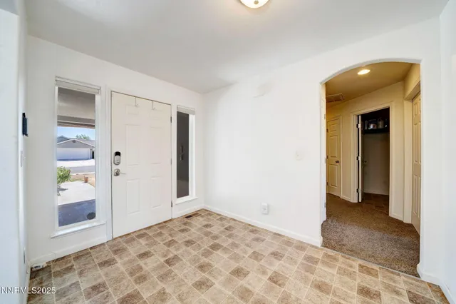 a view of an empty room and window