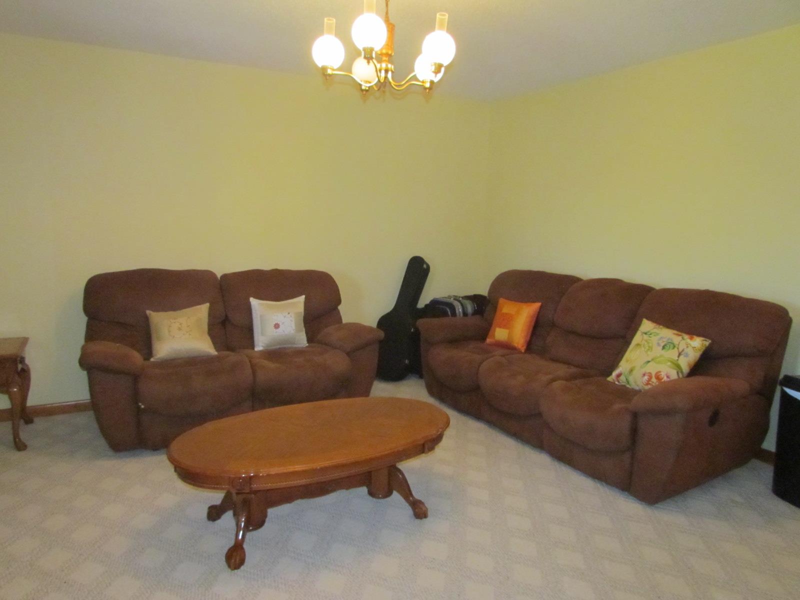 510 Bush Road Manchester, TN 37355 - Photo 4 of 21 a blue couch sitting next to a blue wall