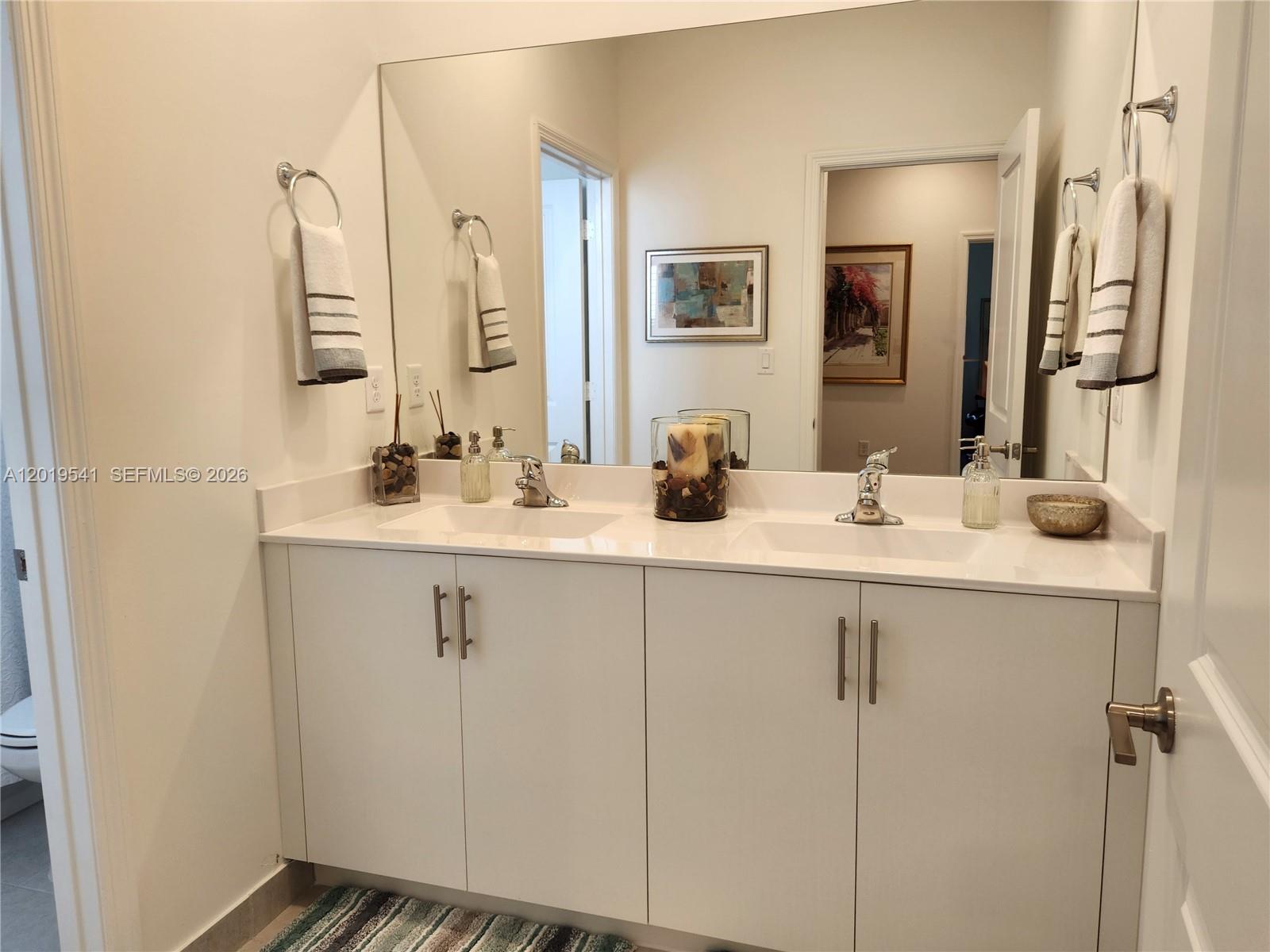 24400 Southwest 119th Place Homestead, FL 33032 - Photo 6 of 22 a bathroom with a sink and a mirror
