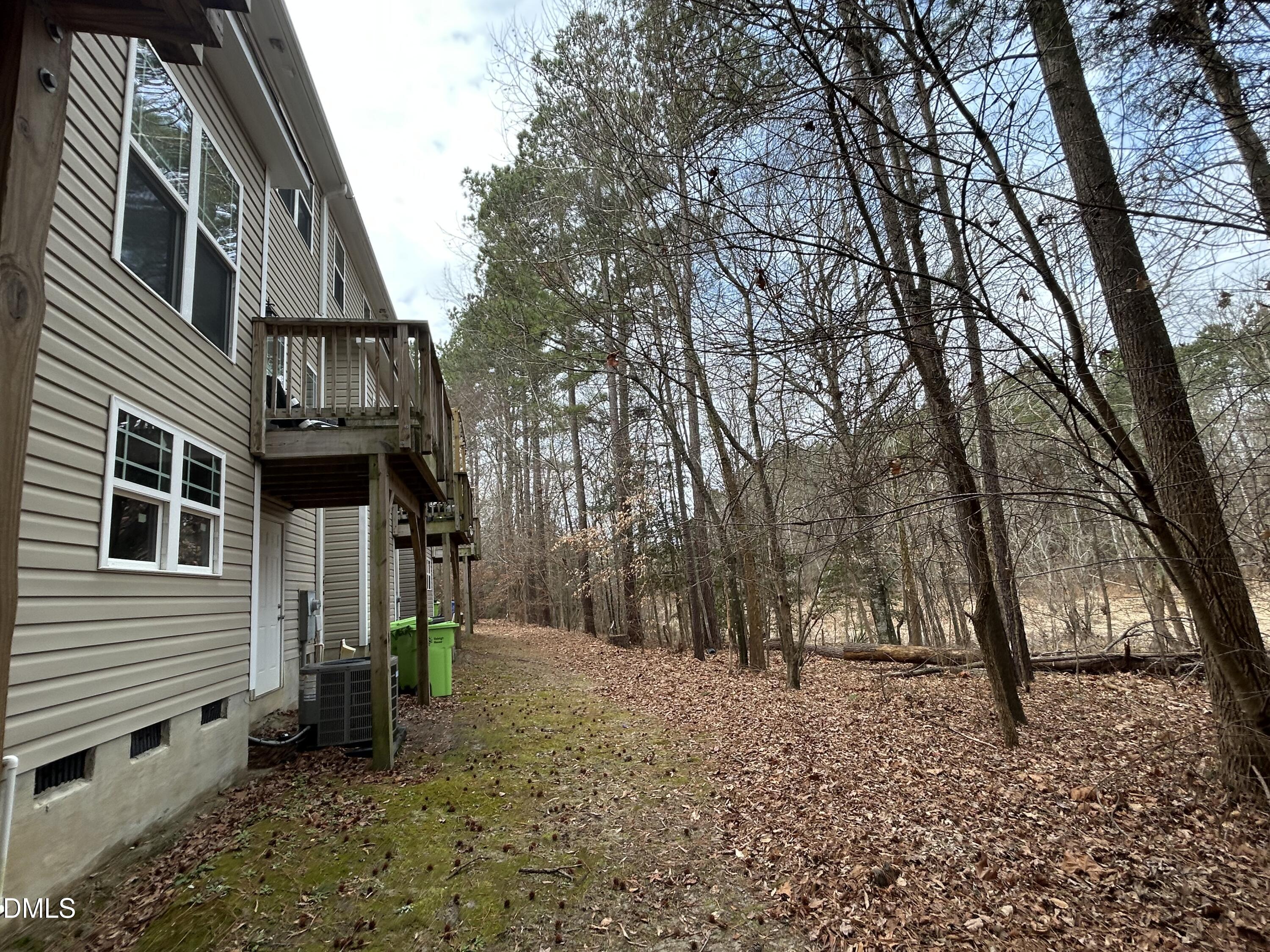 4818 Landover Bluff Way Raleigh, NC 27616 - Photo 29 of 30 a view of a house with a yard