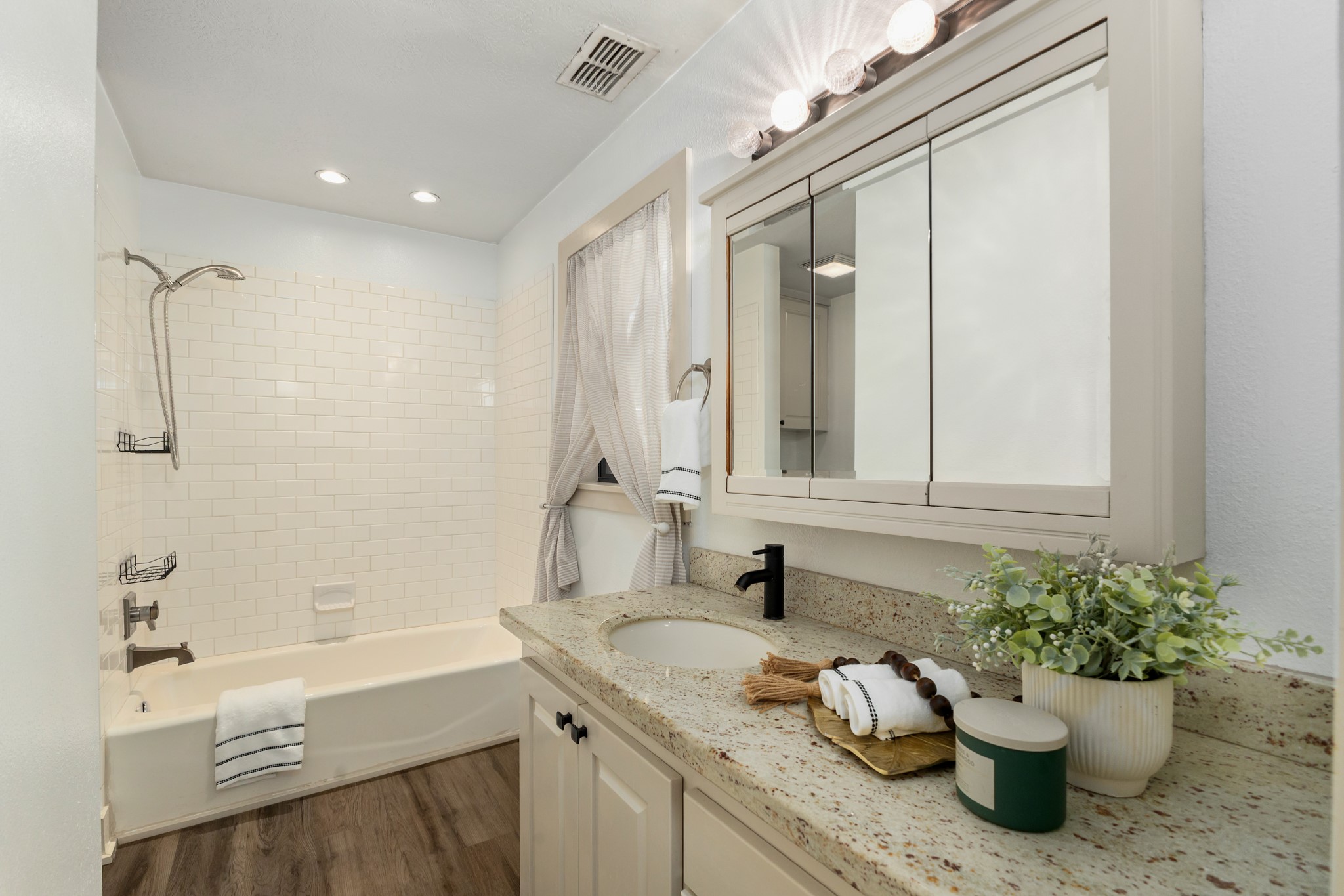 511 West Val Verde Street Brenham, TX 77833 - Photo 11 of 23 a bathroom with a granite countertop sink a toilet and shower