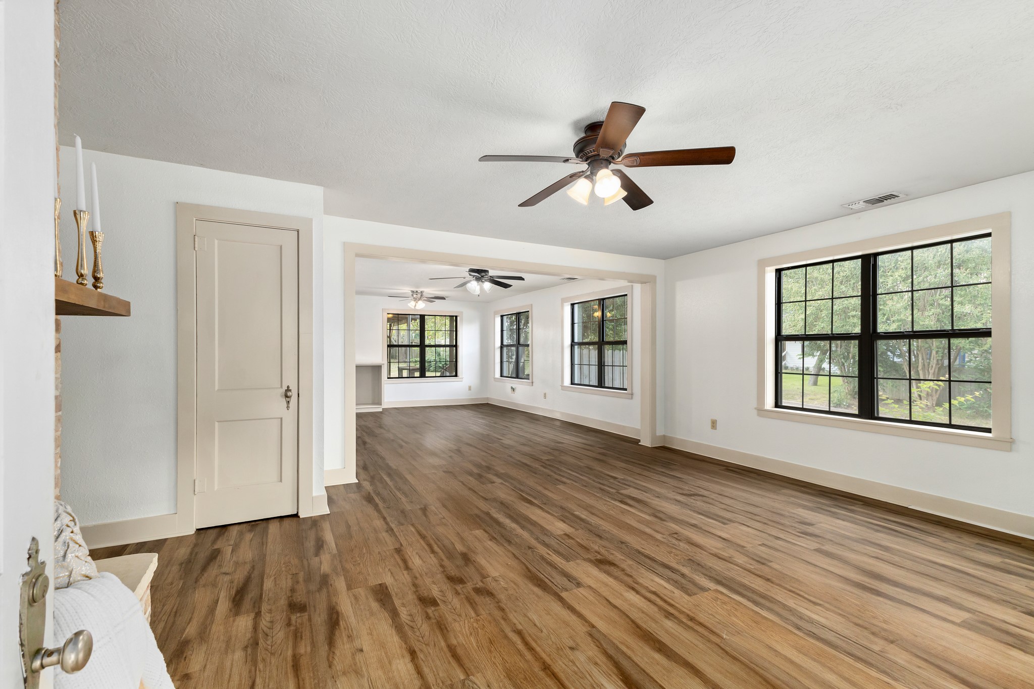 511 West Val Verde Street Brenham, TX 77833 - Photo 2 of 23 a view of empty room with wooden floor and fan