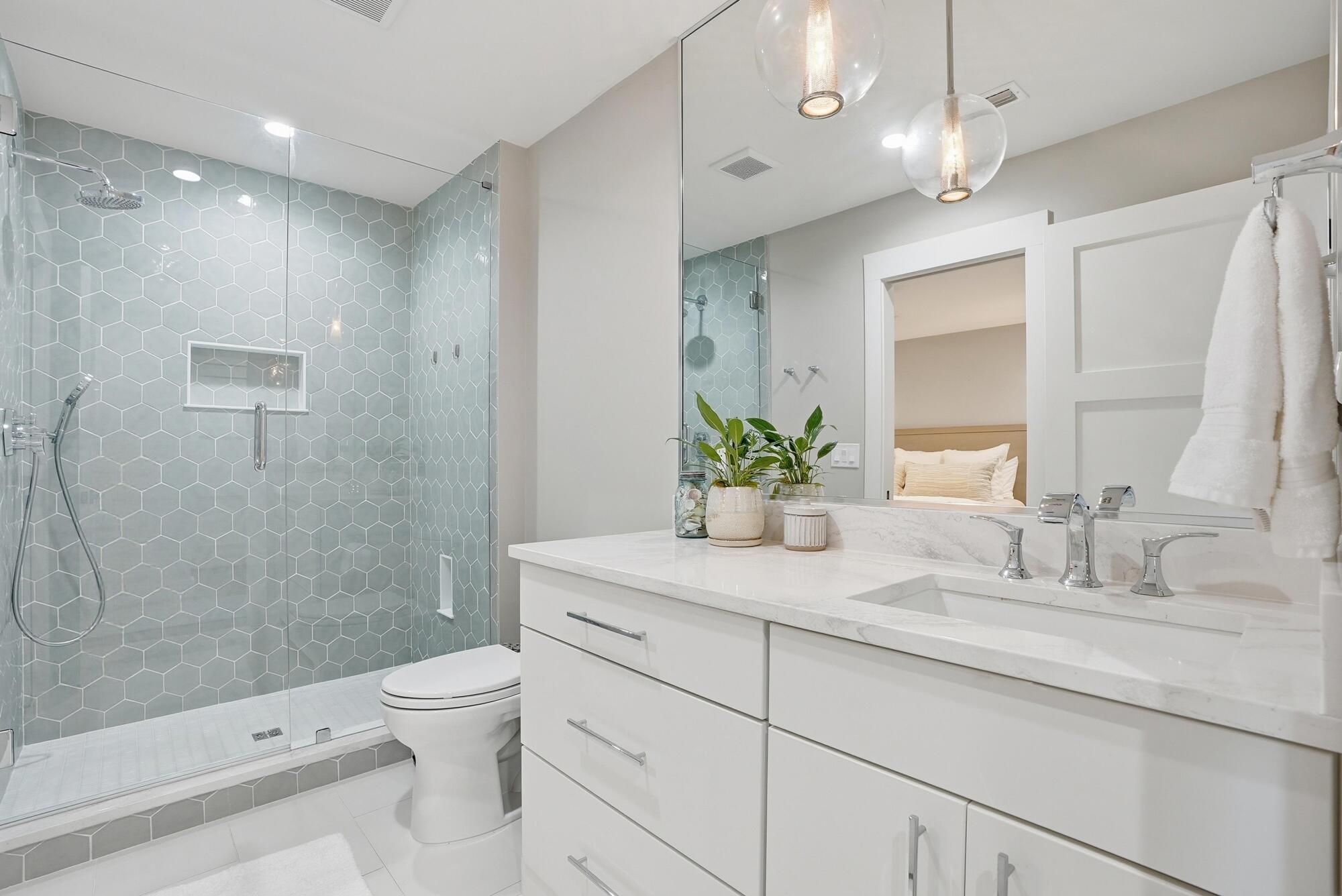 327 Sand Cliffs Drive Inlet Beach, FL 32461 - Photo 19 of 70 a bathroom with a granite countertop sink a toilet and shower