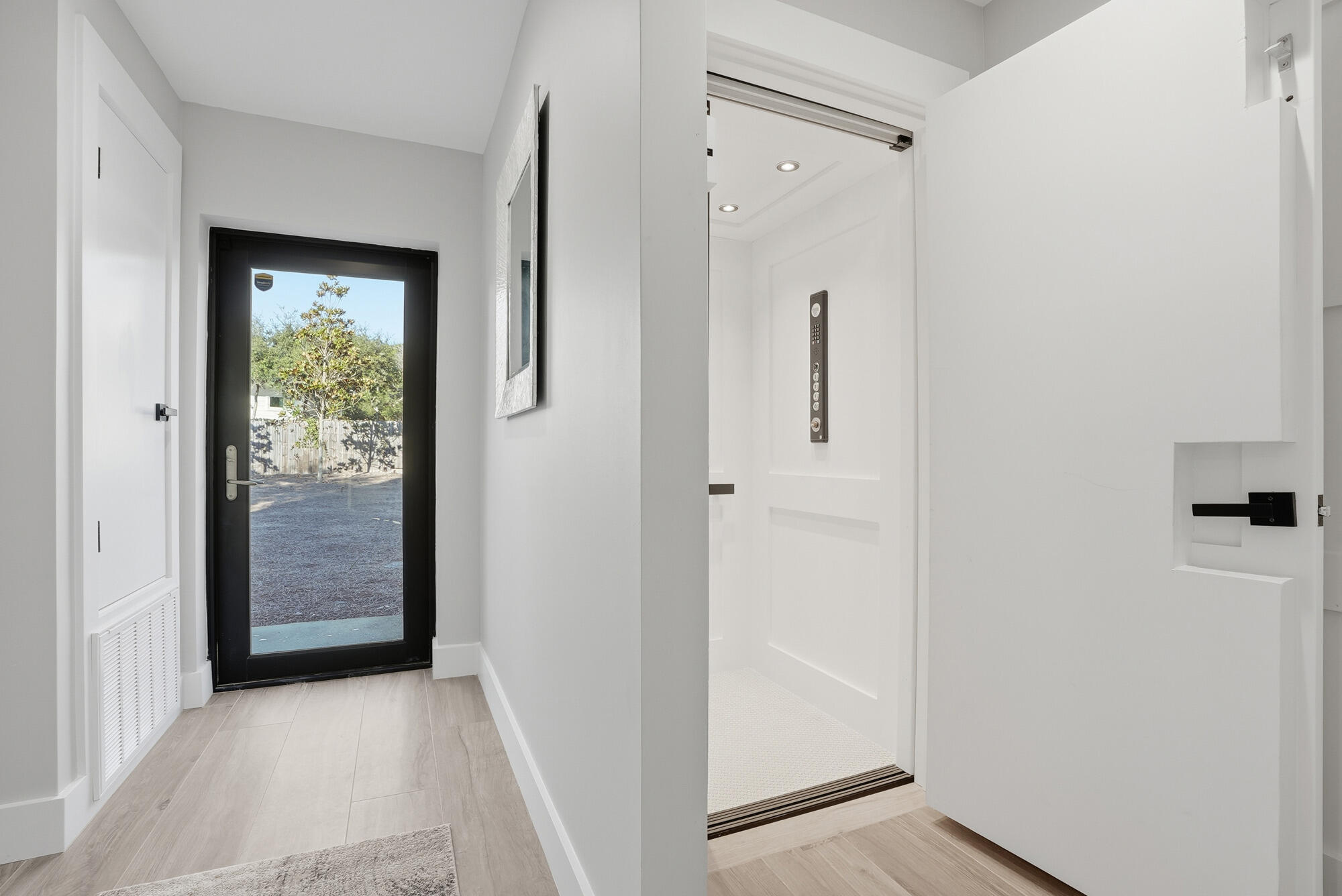327 Sand Cliffs Drive Inlet Beach, FL 32461 - Photo 22 of 70 a view of a hallway with wooden floor and entryway