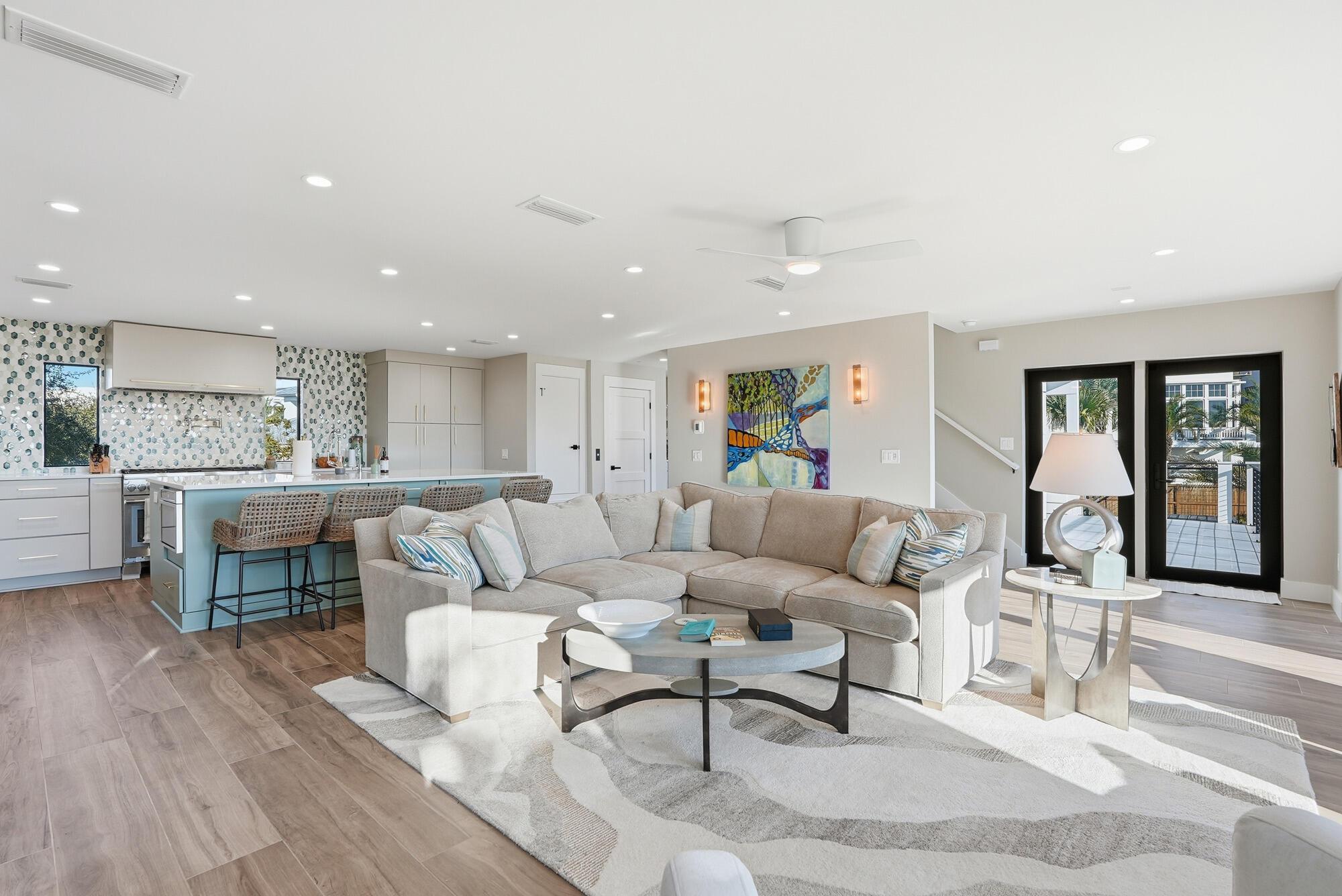 327 Sand Cliffs Drive Inlet Beach, FL 32461 - Photo 31 of 70 a living room with couches and kitchen view with wooden floor
