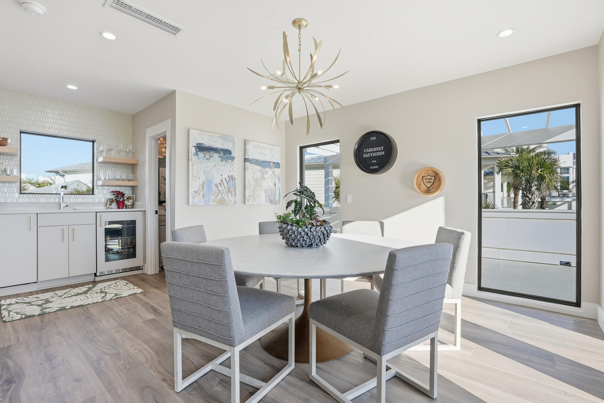 327 Sand Cliffs Drive Inlet Beach, FL 32461 - Photo 36 of 70 a view of a dining room with furniture and wooden floor