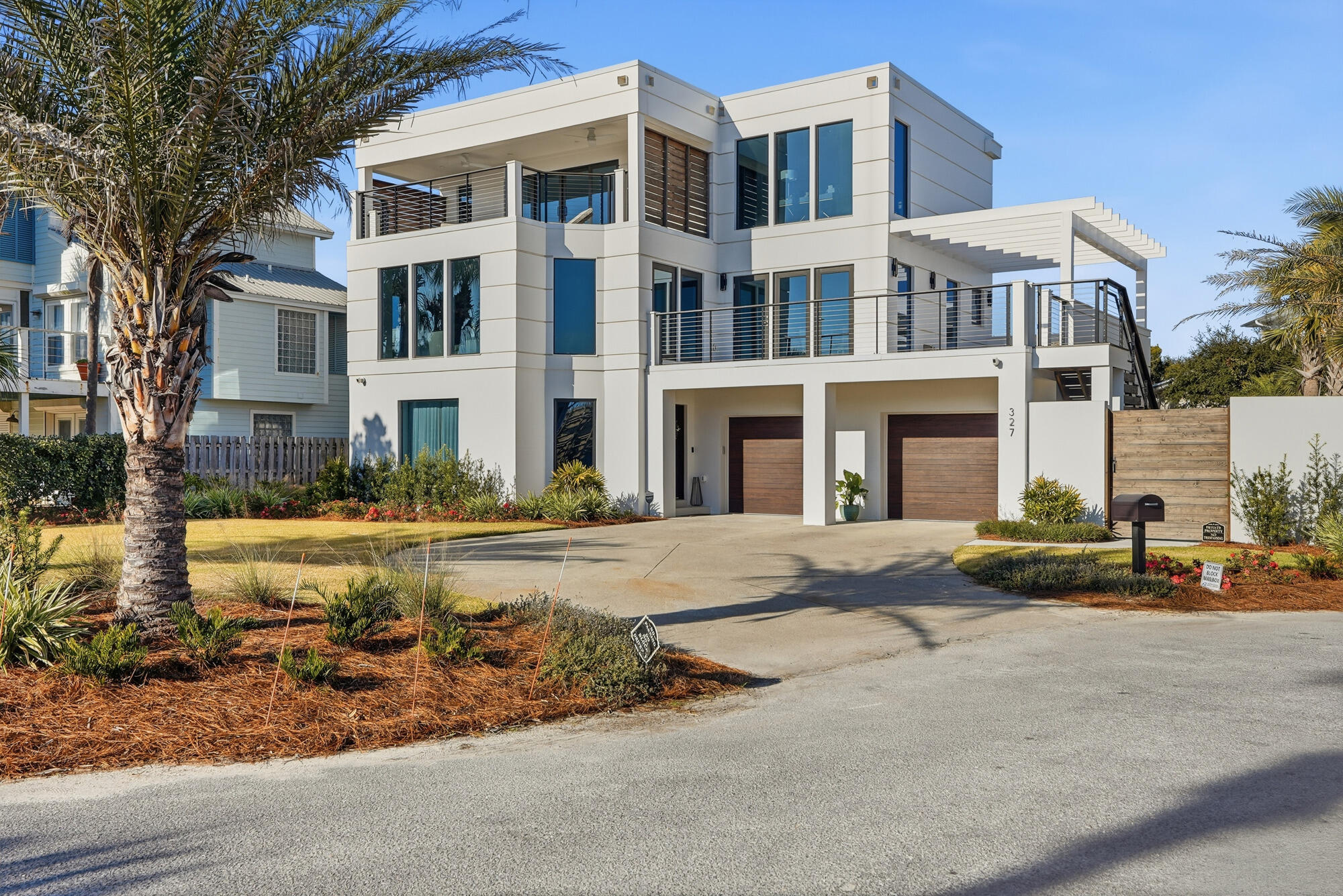 327 Sand Cliffs Drive Inlet Beach, FL 32461 - Photo 10 of 70 a front view of a building with street view