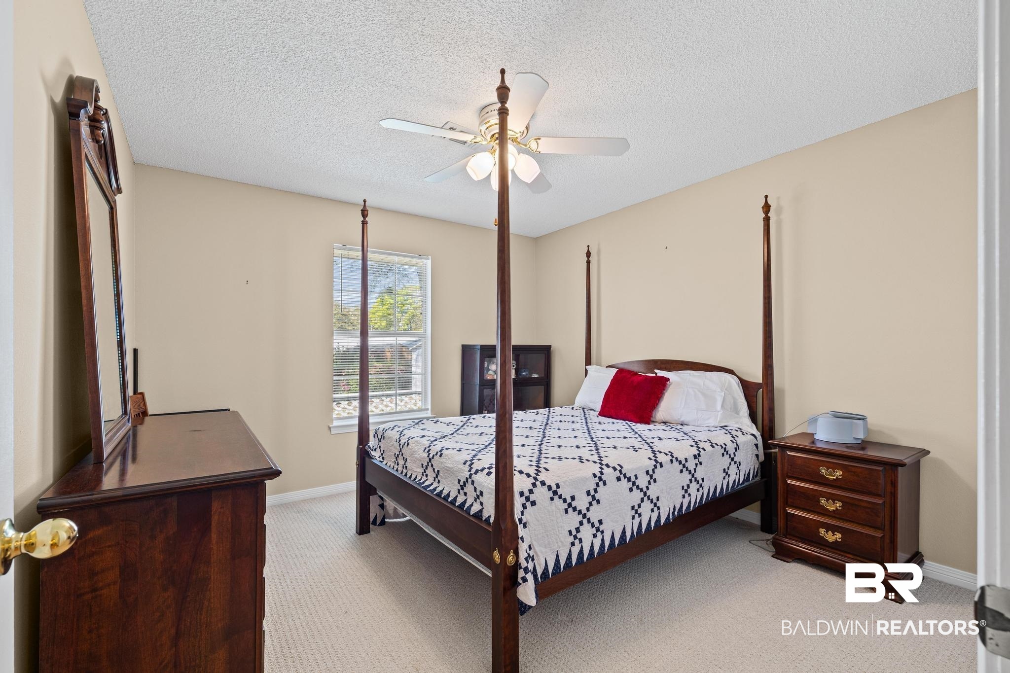 2881 Eslava Circle Lillian, AL 36549 - Photo 22 of 58 Bedroom with carpet floors, ceiling fan, and a textured ceiling