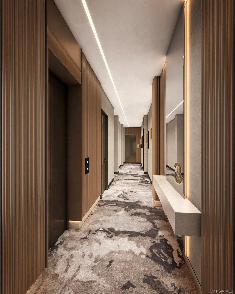 11-50 45th Road, Unit 4K Queens, NY 11358 - Photo 8 of 8 a view of a hallway with wooden fence and windows