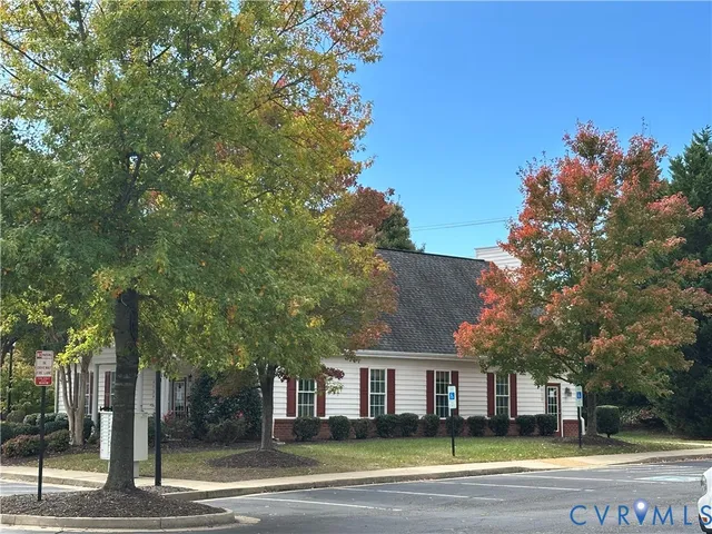 a view of city with tall trees