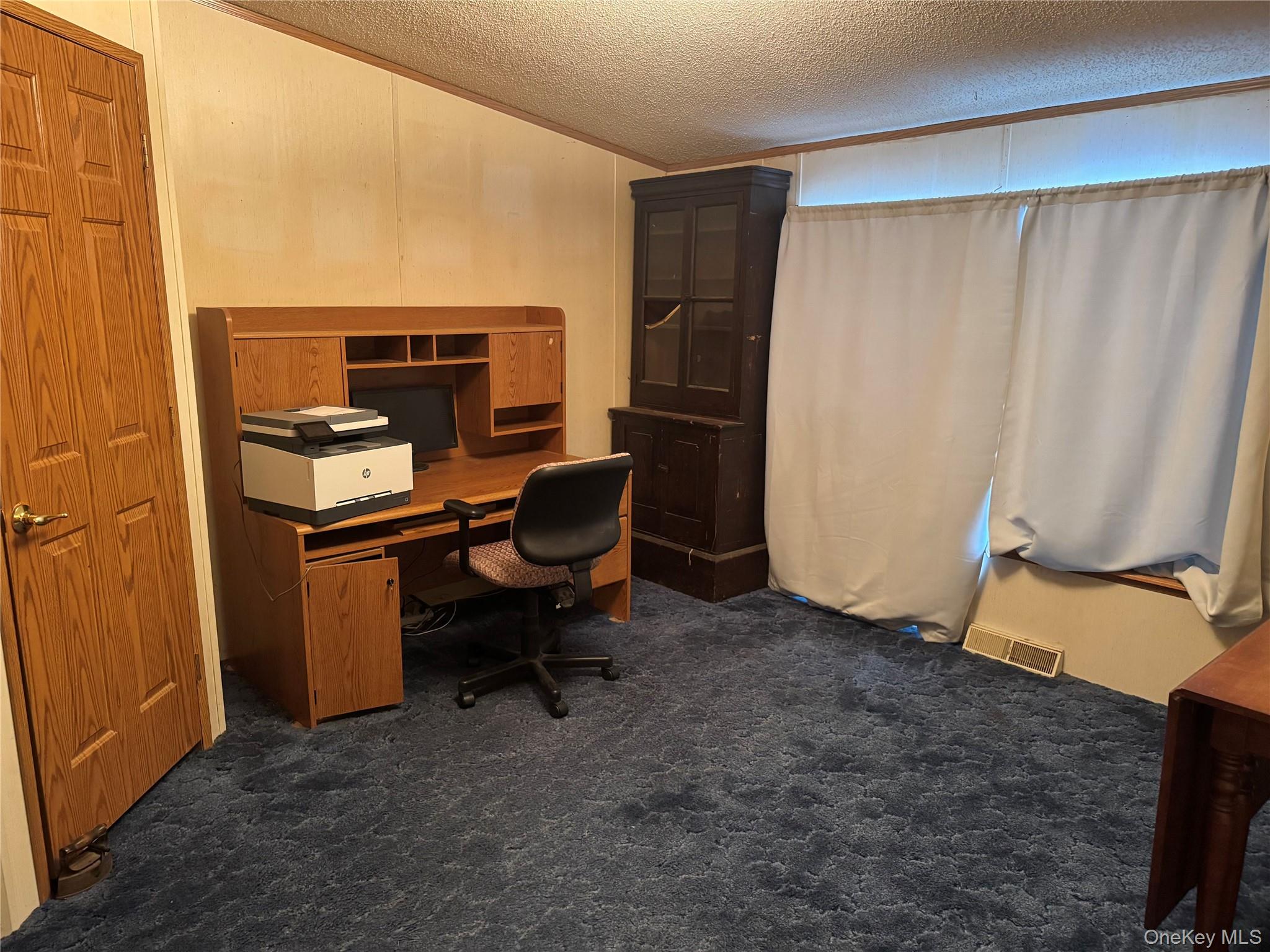 165 Benton Hollow Road Livingston Manor, NY 12758 - Photo 15 of 18 a room with a chair and a fireplace