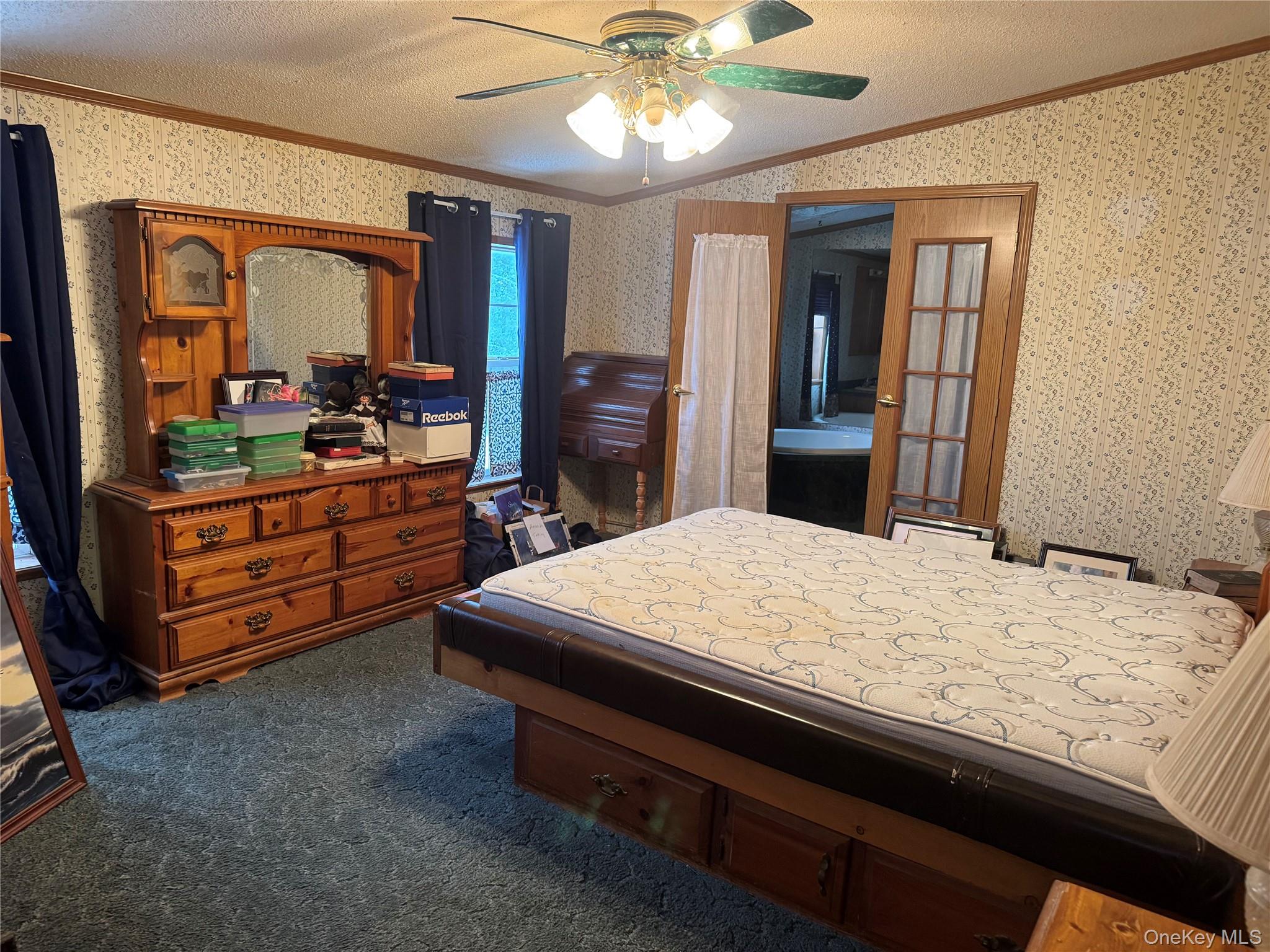 165 Benton Hollow Road Livingston Manor, NY 12758 - Photo 7 of 18 a bed room with a bed and a television