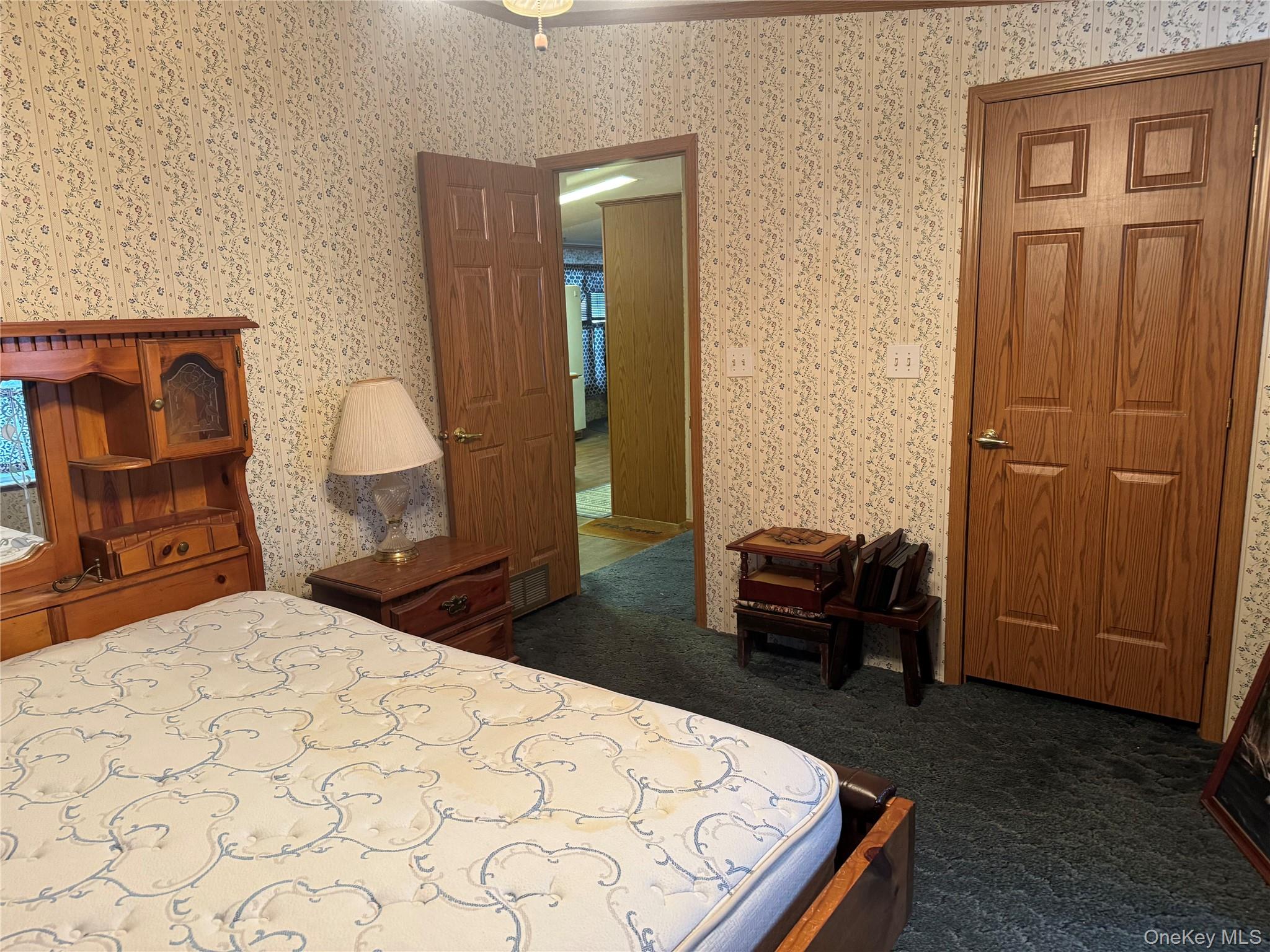 165 Benton Hollow Road Livingston Manor, NY 12758 - Photo 10 of 18 a bedroom with a bed and wooden floor