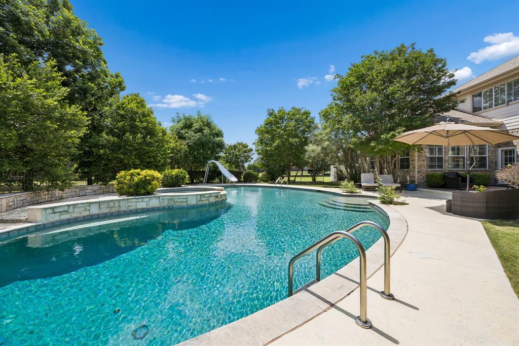 5808 Rathbone Drive Parker, TX 75002 - Photo 35 of 39 Another view of the sparkling pool. The pool area is surrounded by lush greenery and mature trees. Such a lovely oasis!