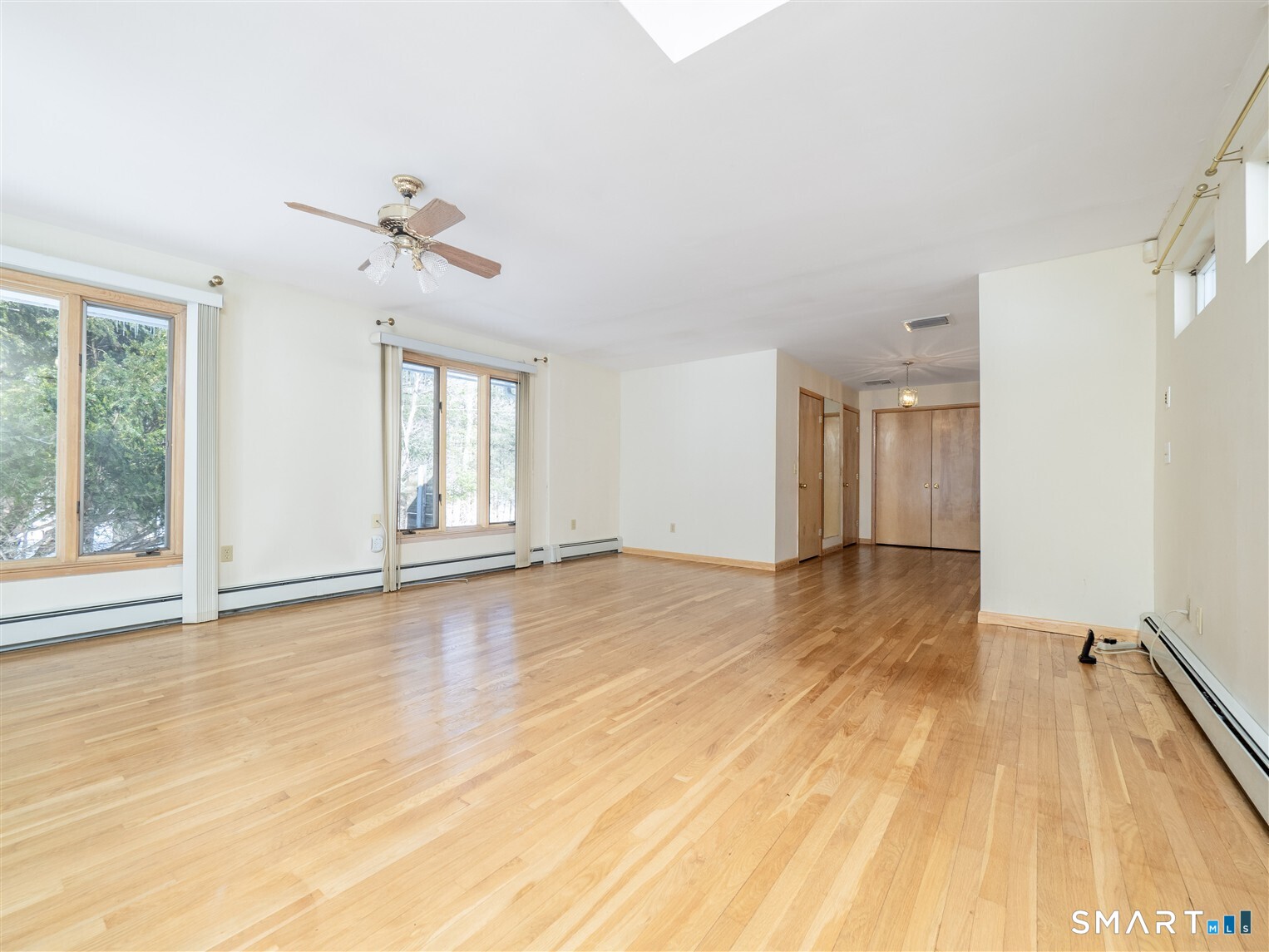 78 Ruscoe Road Wilton, CT 06897 - Photo 11 of 40 a view of a room with wooden floor and windows
