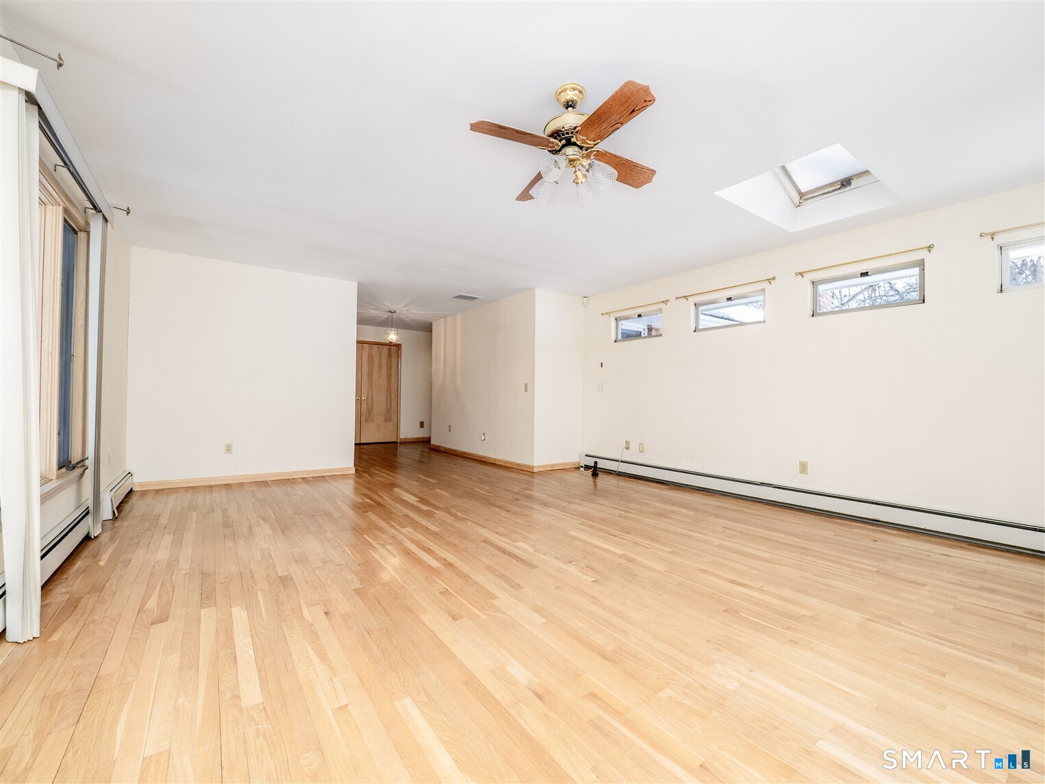 78 Ruscoe Road Wilton, CT 06897 - Photo 12 of 40 a view of a room with wooden floor and white walls