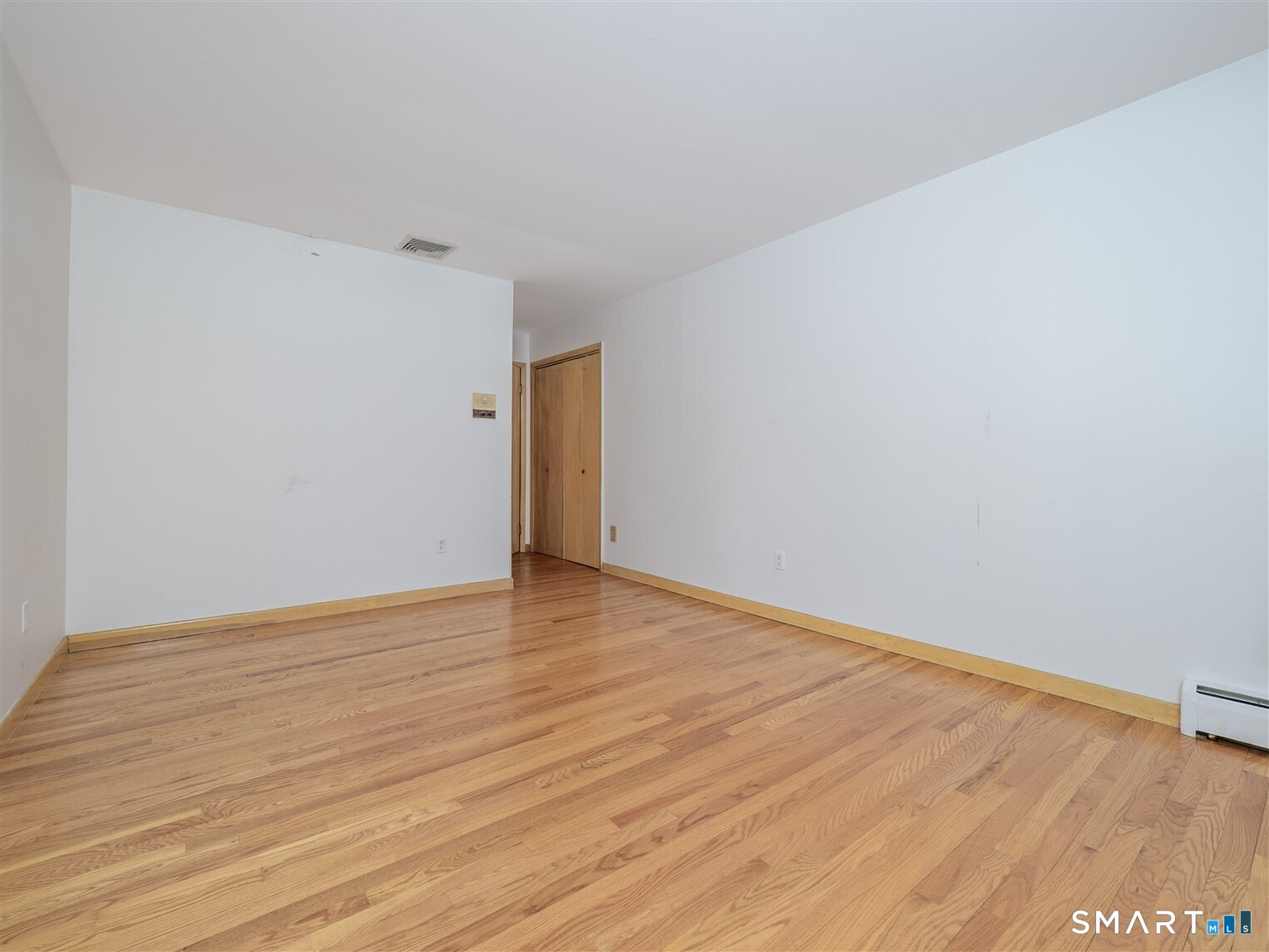 78 Ruscoe Road Wilton, CT 06897 - Photo 15 of 40 a view of an empty room with wooden floor
