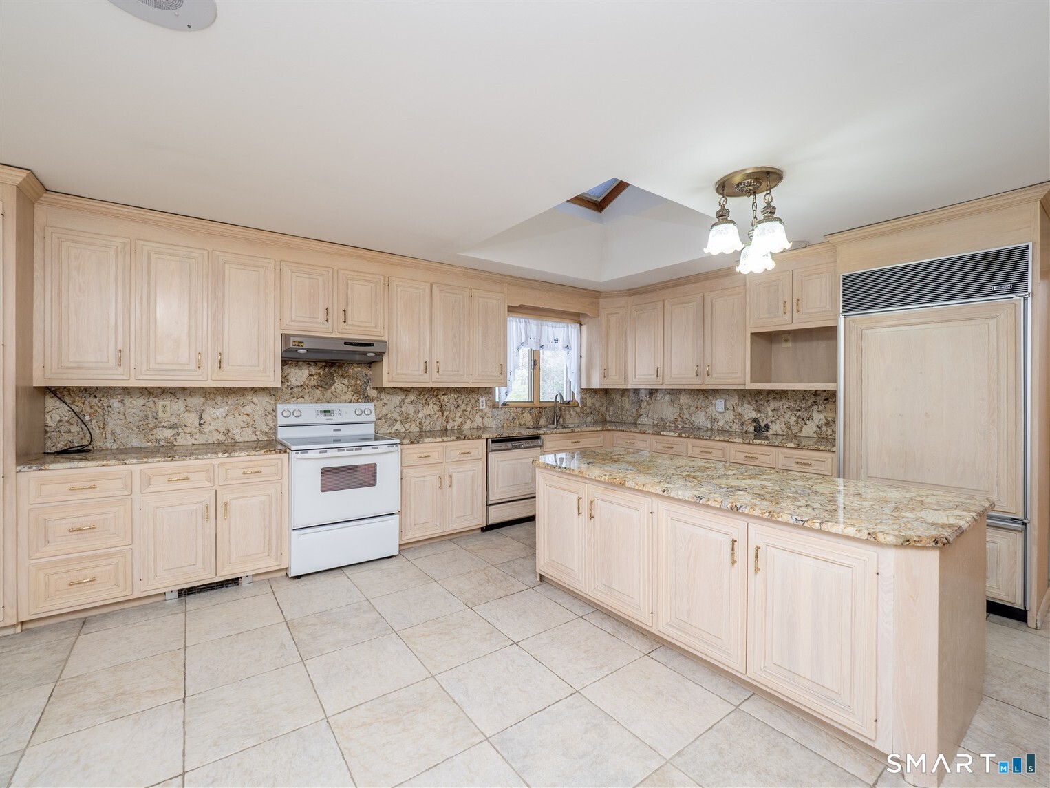 78 Ruscoe Road Wilton, CT 06897 - Photo 20 of 40 a kitchen with kitchen island granite countertop white cabinets white stainless steel appliances with a sink and dishwasher