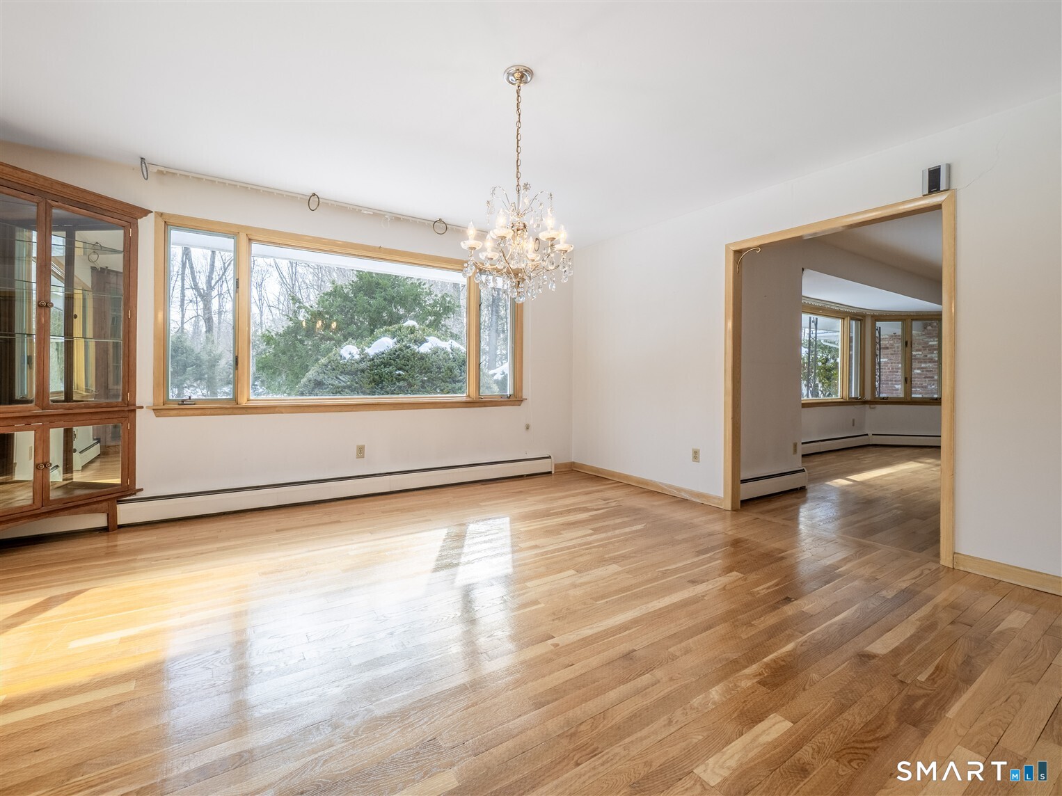 78 Ruscoe Road Wilton, CT 06897 - Photo 23 of 40 an empty room with wooden floor and windows