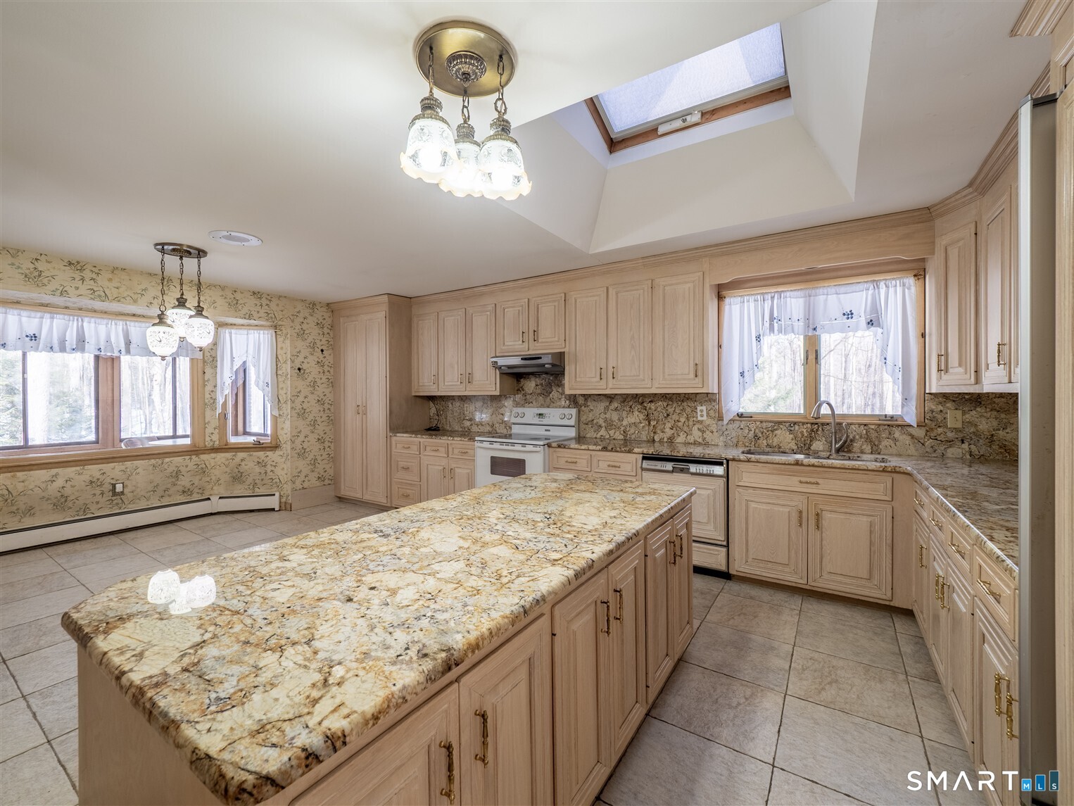 78 Ruscoe Road Wilton, CT 06897 - Photo 26 of 40 a kitchen with stainless steel appliances granite countertop a sink stove and cabinets