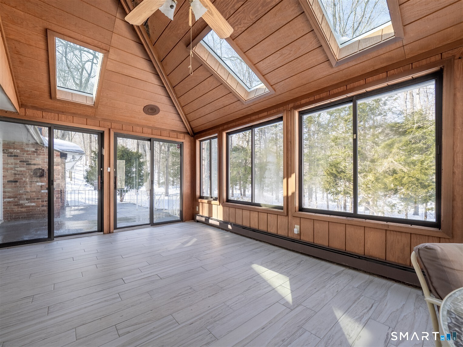 78 Ruscoe Road Wilton, CT 06897 - Photo 30 of 40 a view of an empty room with a window and wooden floor