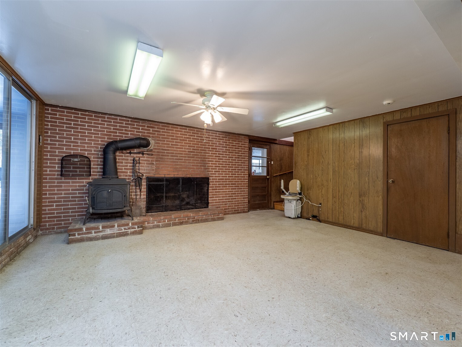 78 Ruscoe Road Wilton, CT 06897 - Photo 33 of 40 a big room with closet and a fireplace