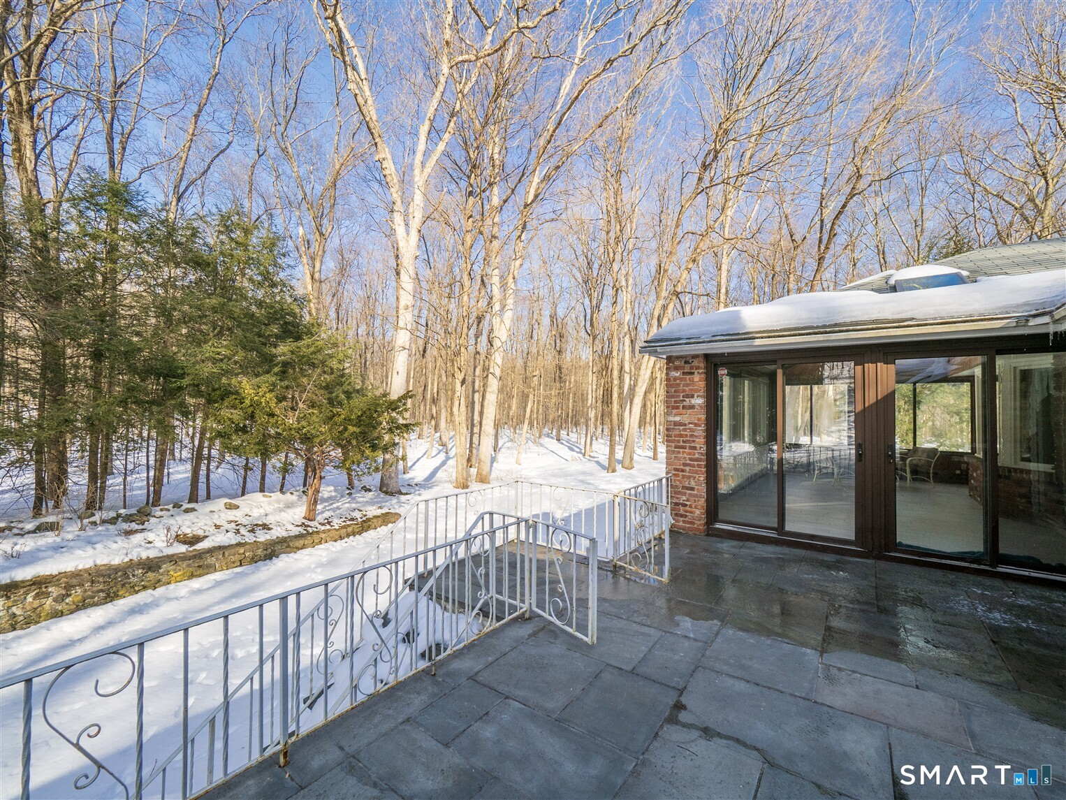 78 Ruscoe Road Wilton, CT 06897 - Photo 5 of 40 a view of a house with a wooden deck and a backyard