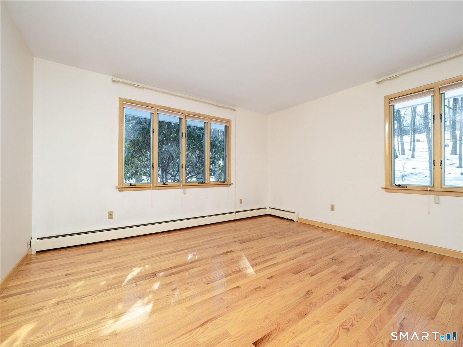 78 Ruscoe Road Wilton, CT 06897 - Photo 6 of 40 an empty room with wooden floor and windows