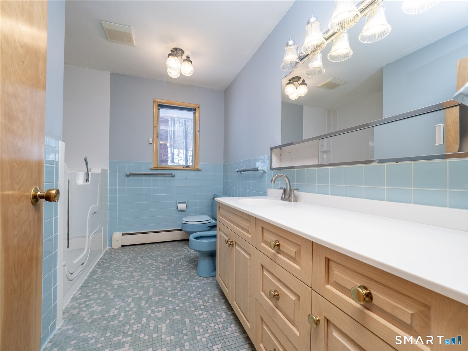 78 Ruscoe Road Wilton, CT 06897 - Photo 7 of 40 a bathroom with a sink a toilet and mirror